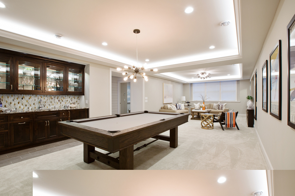 A pool table in a basement room
